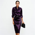 Purple satin cocktail midi dress with draped cowl neck, 3/4 sleeves and waist belt.