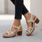 Light beige women's T-strap sandals with block heel and cushioned footbed, buckle strap