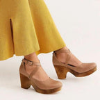 Tan cross-strap Mary Jane platform heels with wide ankle strap