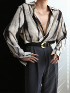 Women's abstract print button-down shirt, dark tones, long sleeves, button front, pointed collar