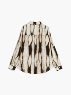 Women's abstract print button-down shirt, cream base with dark drips, long sleeves, button front