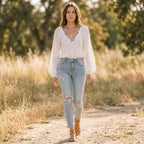 White relaxed V-neck blouse with lace-trim neckline and puff sleeves