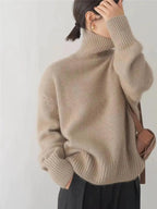 Women's beige turtleneck sweater with ribbed collar and cuffs, long sleeve knit