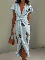 Light blue leaf-print V-neck midi dress with tied waist bow and wrap front slit