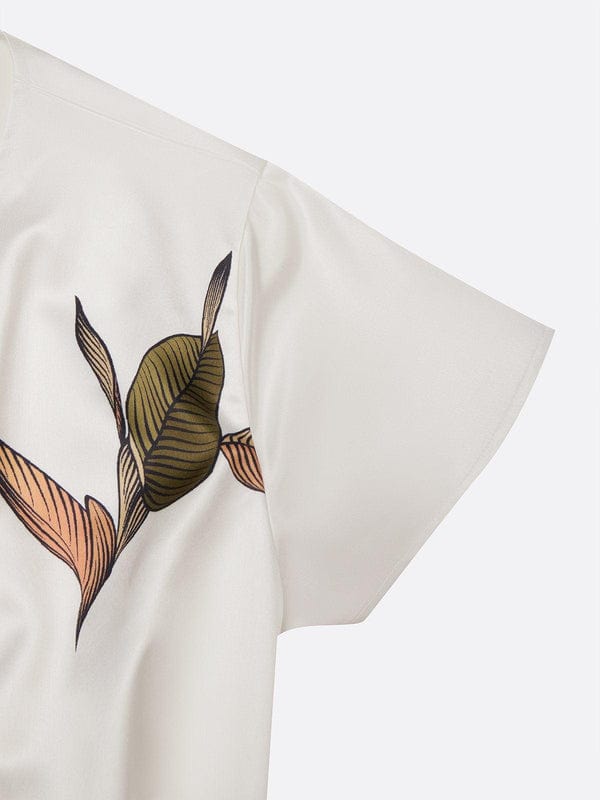 White fabric close-up with multicolor leaf print