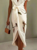White leaf-print midi wrap dress with bow belt and V-neck front