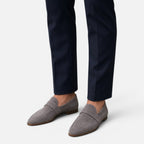 Women's suede pointed-toe loafers, gray slip-on with stitched saddle and low sole.