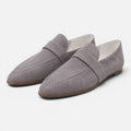 Women's gray suede pointed-toe loafers, slip-on style with strap and low sole.