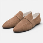 Women's beige suede pointed-toe loafers, slip-on with strap detail and low sole.