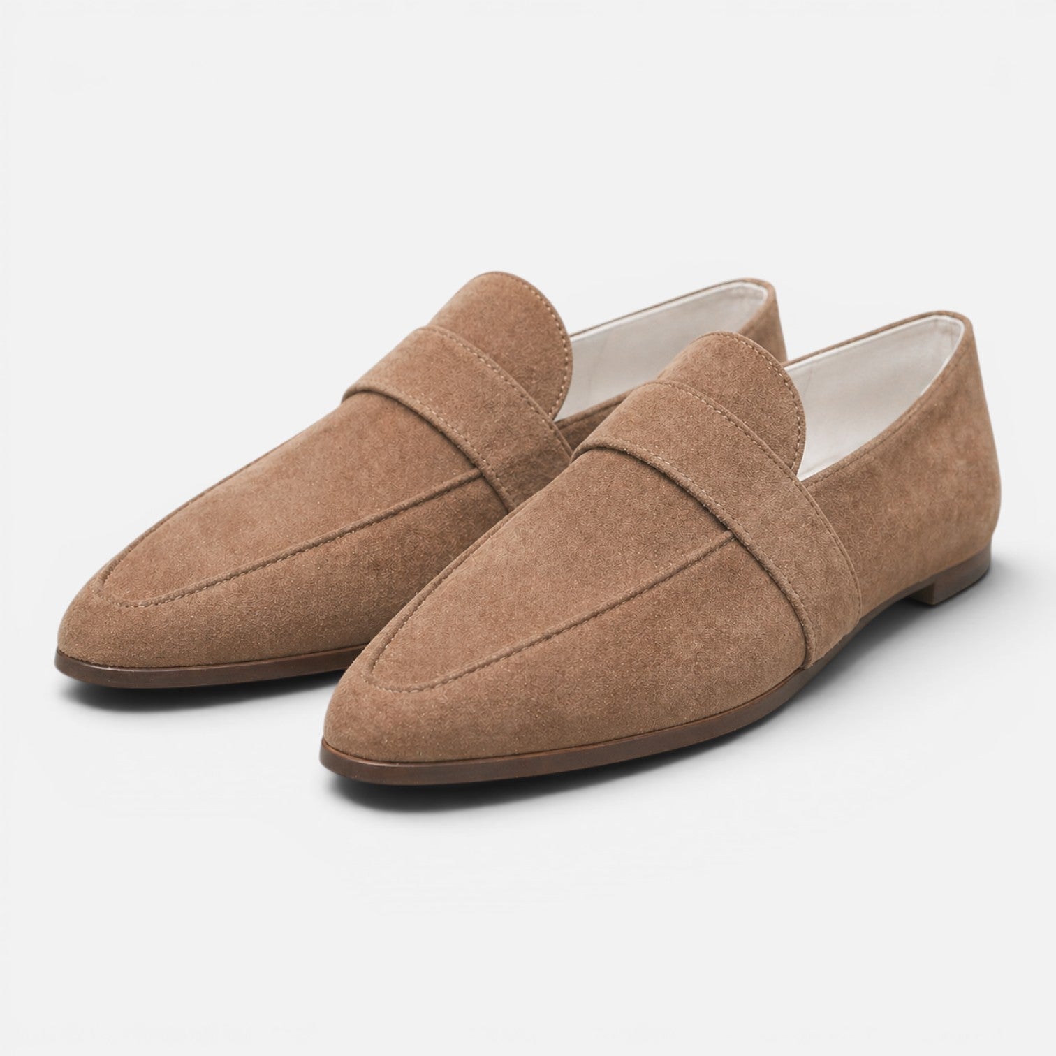 Women's beige suede pointed-toe loafers, slip-on with strap detail and low sole.
