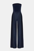 Dark blue strapless corset wide-leg jumpsuit with cinched bodice and wide trousers