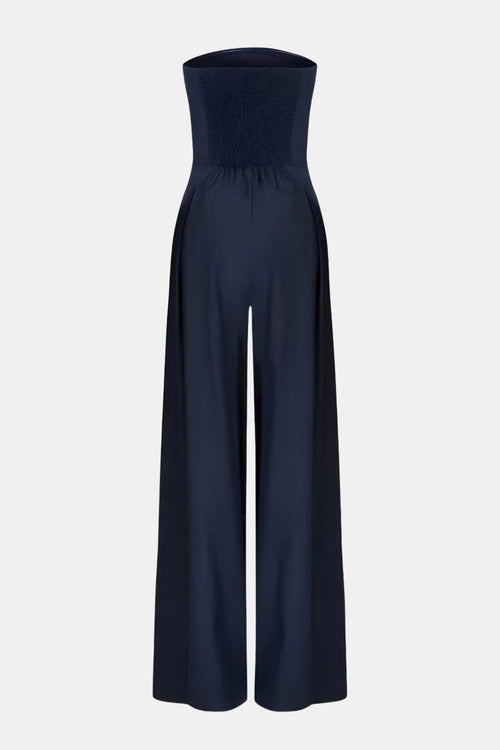 Dark blue strapless corset wide-leg jumpsuit with cinched bodice and wide trousers