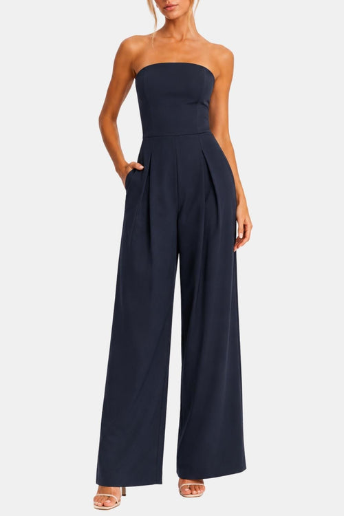Dark blue strapless corset wide-leg jumpsuit worn with fitted bust and full-length pants