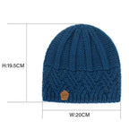 Blue ribbed knit beanie hat with small brown brand patch