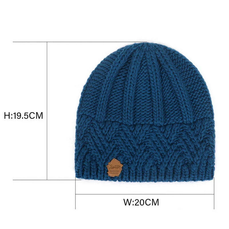 Blue ribbed knit beanie hat with small brown brand patch