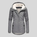 Gray long hooded winter coat with faux fur lining, zip front, flap pockets.