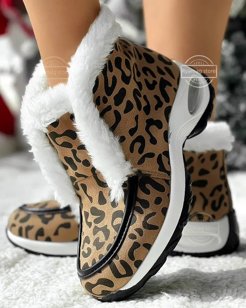 Women’s ankle platform boots with leopard print upper, white faux-fur trim, black outsole.