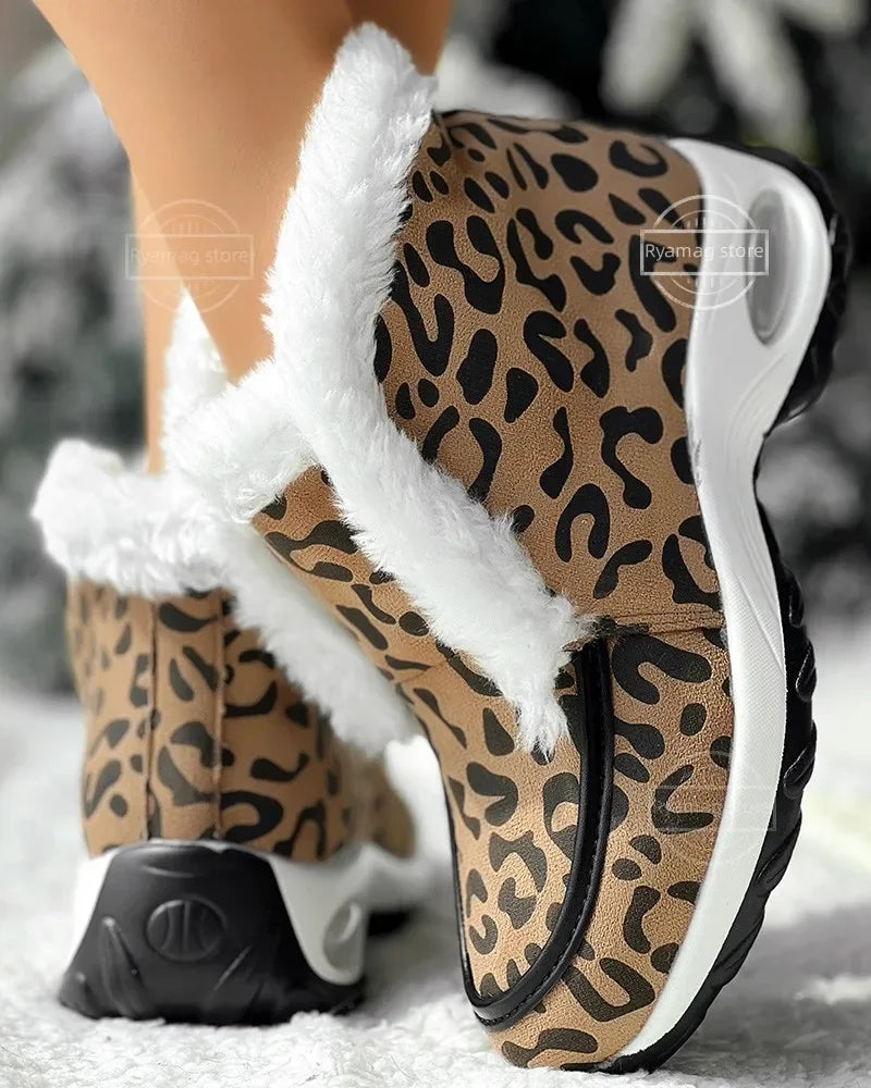 Women’s ankle platform boots with leopard print upper and white faux-fur trim, side view.