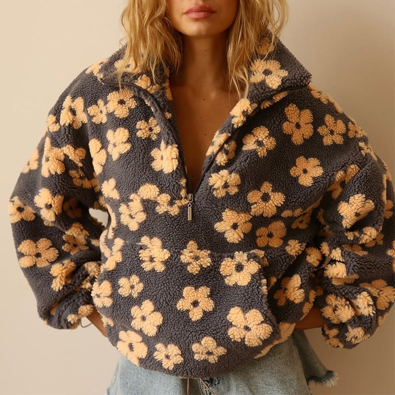 Women’s dark fuzzy quarter-zip sweater with yellow floral print and zip-front opening