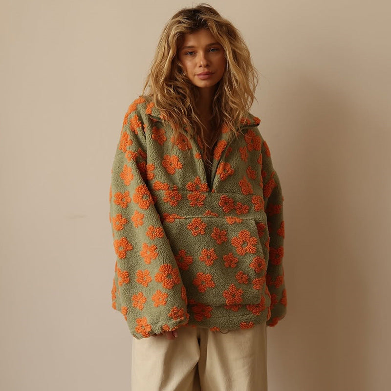 Women’s fuzzy quarter-zip sweater in green with orange floral print and half-zip front