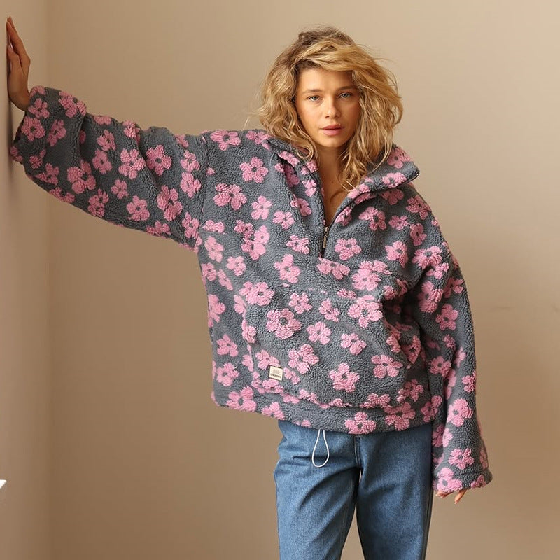 Women’s dark fuzzy quarter-zip sweater with pink floral print and zip-front neckline