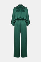 Green cape-sleeve jumpsuit with high neck and cinched waist, wide-leg pants.