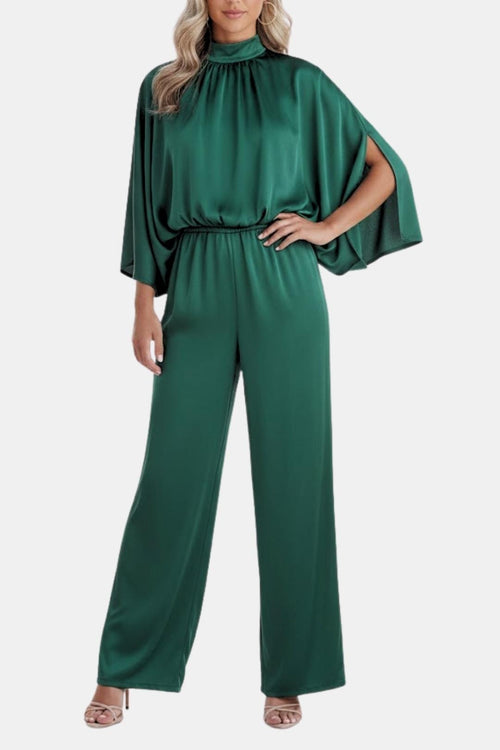 Green cape-sleeve jumpsuit, relaxed wide-leg fit with gathered high neckline.