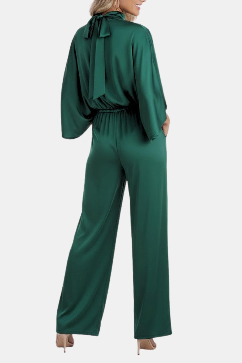 Green cape-sleeve jumpsuit back view with tie neck and cinched elastic waist.