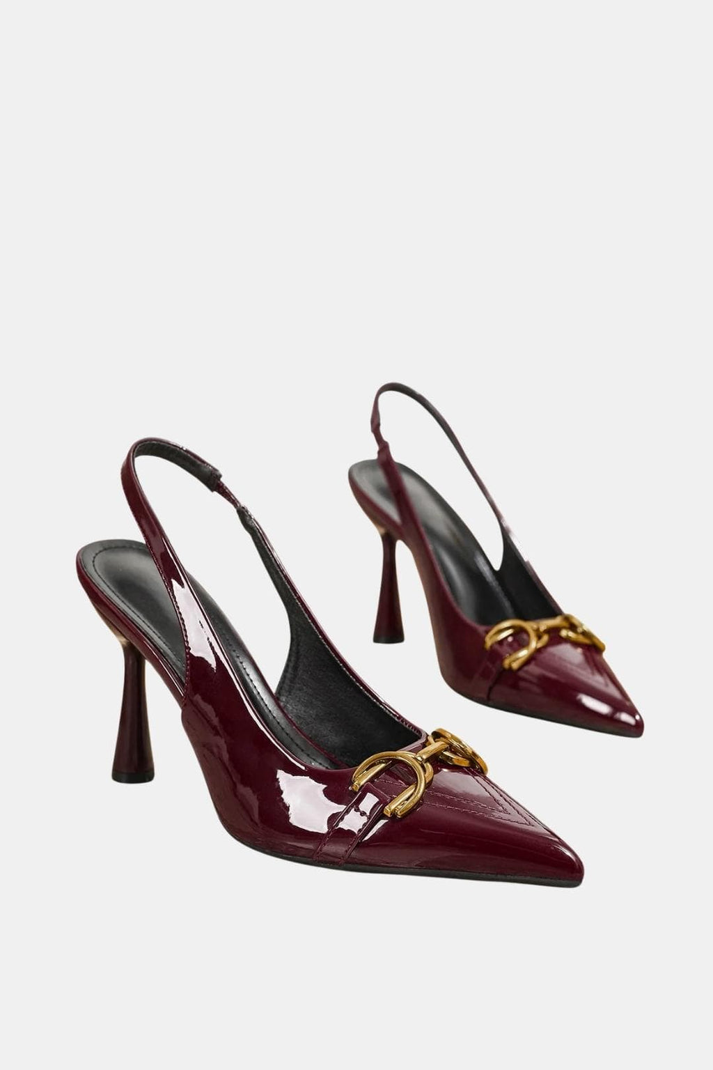 Burgundy patent horsebit slingback pumps with gold buckle detail and pointed toe