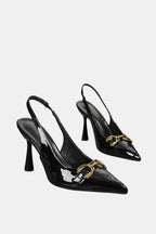 Black patent horsebit slingback pumps with gold buckle detail and pointed toe
