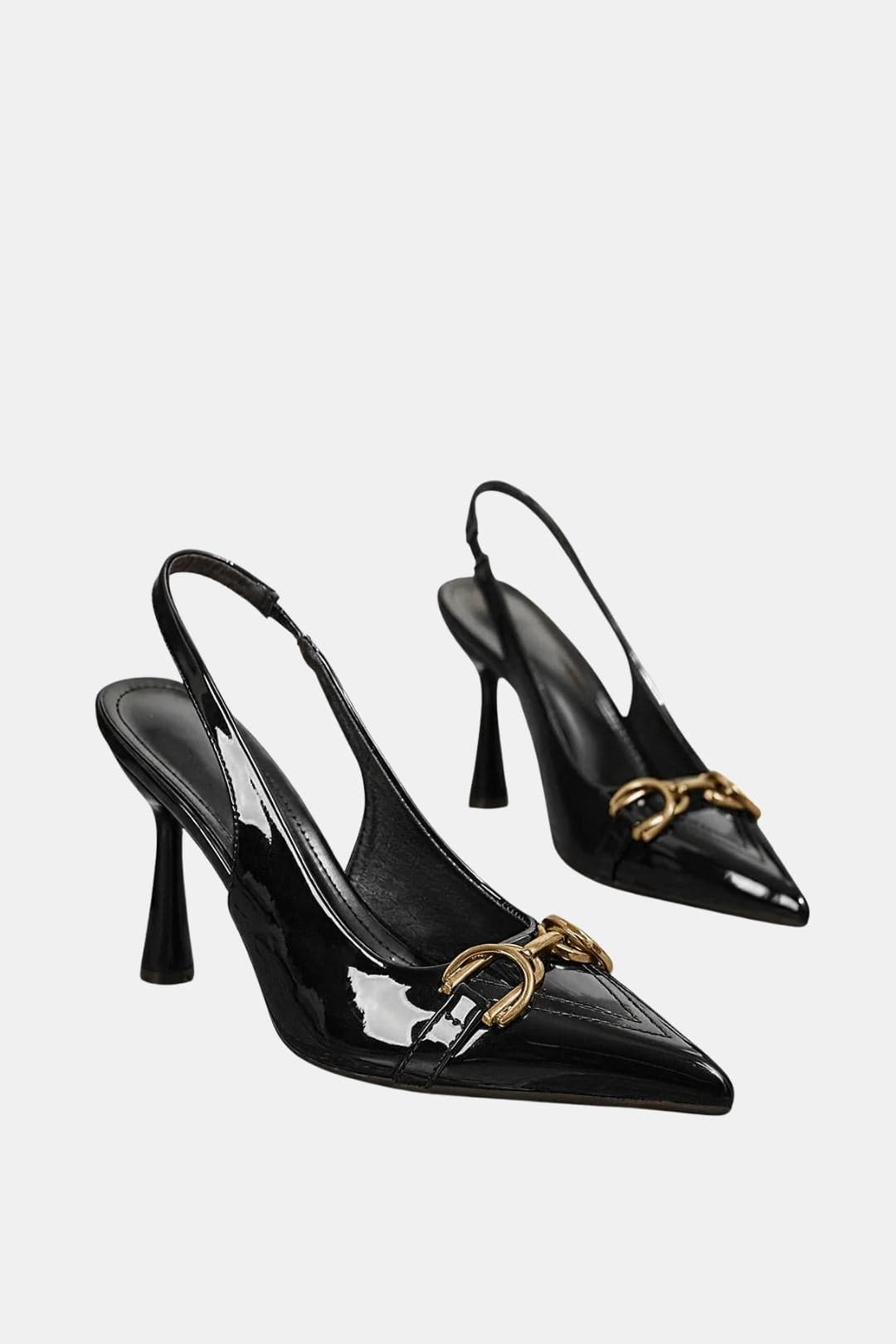 Black patent horsebit slingback pumps with gold buckle detail and pointed toe
