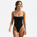 Two-tone high-waisted bikini set with black fabric and white trim along the bust and sides