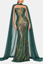 Green sequin mermaid evening dress with strapless neckline and flowing cape