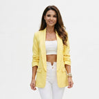 Women’s yellow blazer with notch lapel and front flap pockets