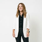 Women’s white blazer with notch lapel and front flap pockets