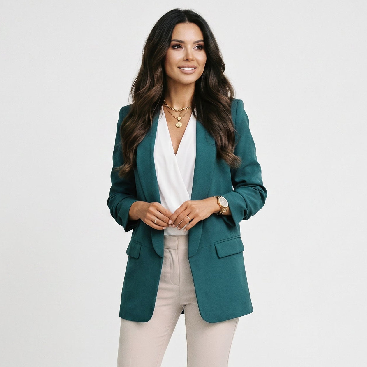 Women’s teal blazer with notch lapel, front pockets, and single-button closure