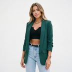 Women’s dark green blazer with notch lapel and front flap pockets