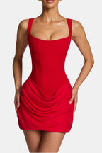 Red corset-style mini dress with square neckline and draped ruched overlay skirt