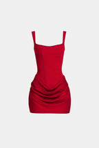 Red corset-style mini dress with square neckline and ruched draped overlay skirt