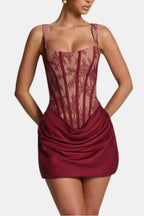 Burgundy lace corset mini dress with square neckline and draped overlay skirt