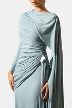 Light blue ruched maxi dress with side knot detail and draped cape sleeve