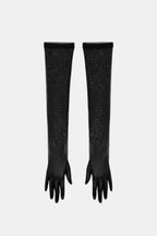 Black sheer patterned gloves, long elbow-length style with open tops and ties