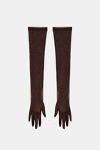 Sheer mesh elbow-length gloves in chocolate brown with patterned stretch and fringed fingertips.