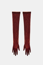 Sheer mesh elbow-length gloves in wine red with patterned stretch and fringed fingertips.