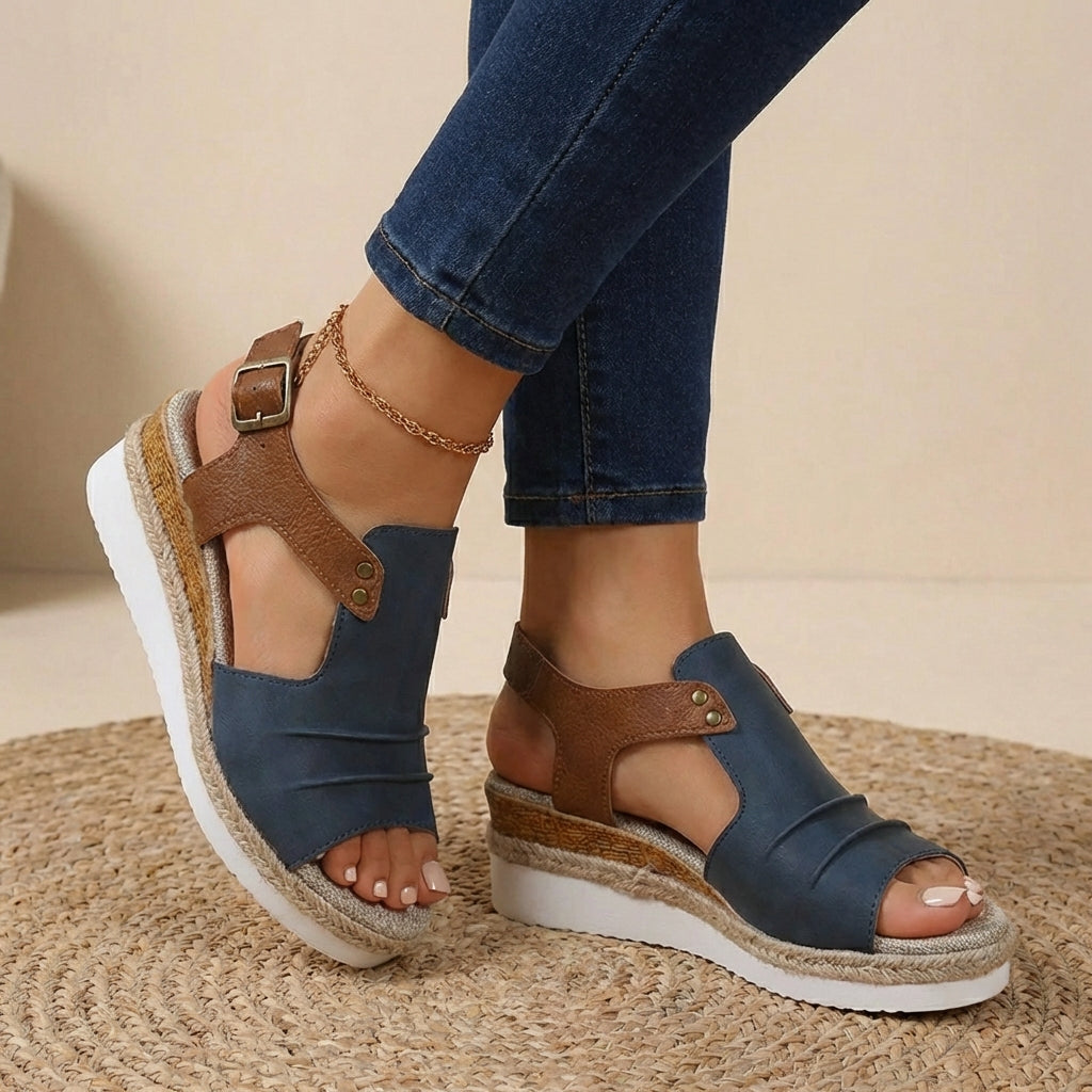 Navy blue and brown platform orthopedic sandals with buckled ankle strap and open toe