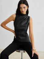 Black sleeveless faux leather mock-neck top with high neckline and fitted draped front
