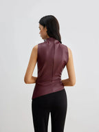 Burgundy sleeveless faux leather mock-neck top, sleeveless with high neckline, back view