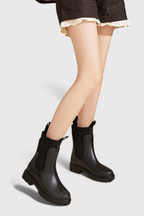 Women’s black slip-on ankle boots with elastic gore and chunky treaded sole