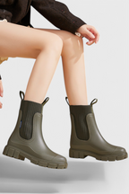 Women’s olive green slip-on ankle boots with elastic gore and chunky tread sole