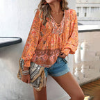 Boho floral print blouse in orange, V-neck tie, gathered neckline, long balloon sleeves